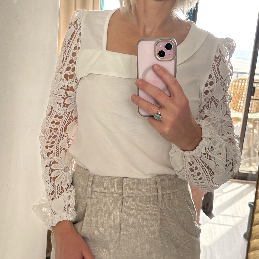 NWOT White long sleeve top with soft knit body and lace sleeves.